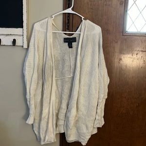 white cardigan with pockets